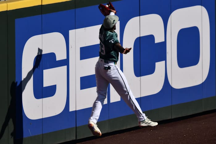 American League right fielder Adolis GarcIa of the Texas Rangers makes a catch during the first inning at T-Mobile Park.